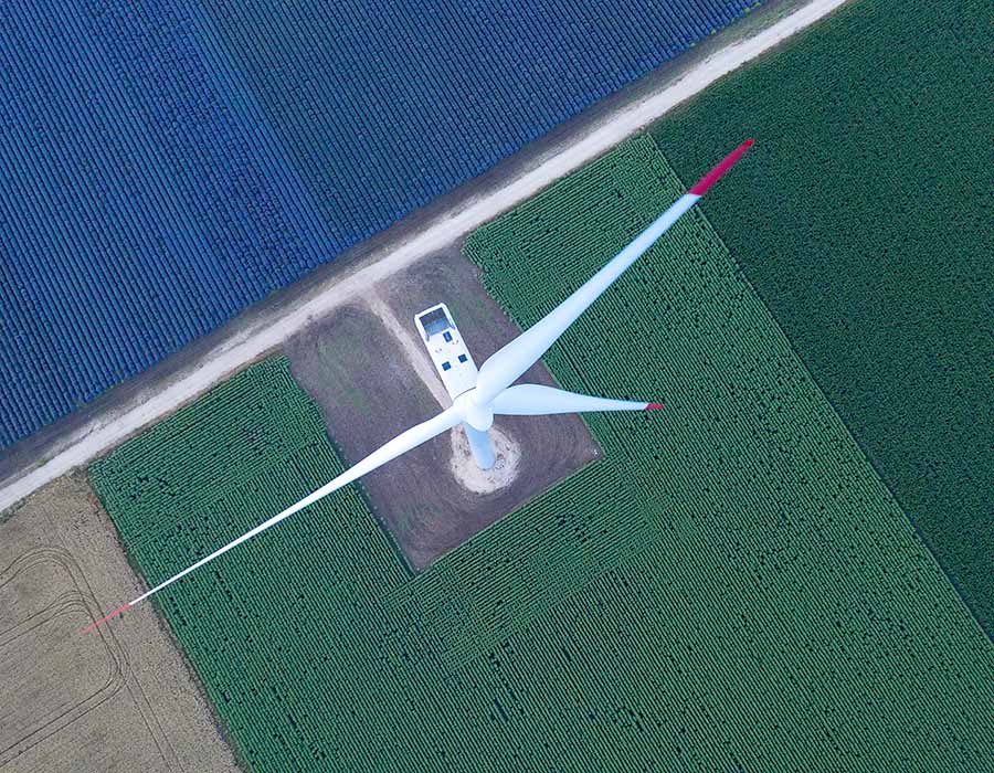 Aerial shot of a windmill, green energy, alternative energy technology