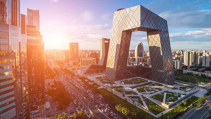 Beijing's CCTV 51-floor skyscraper at sunset relevant to China's Two Sessions meeting