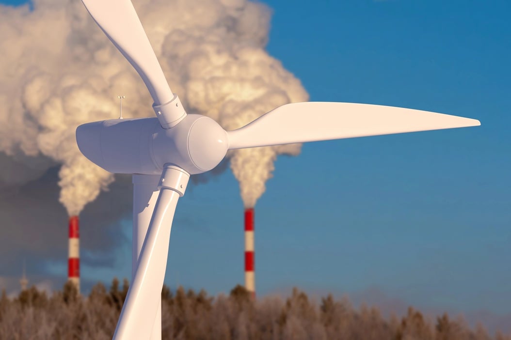 Wind farm on the background of the chimneys of thermal plant